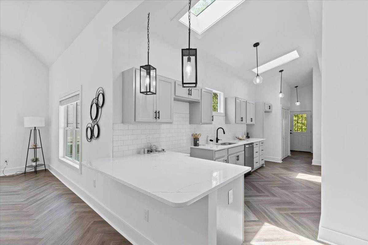1506 Chapel Hill Road Durham, NC 27701 - Photo 14 of 50 a kitchen with stainless steel appliances sink refrigerator and microwave