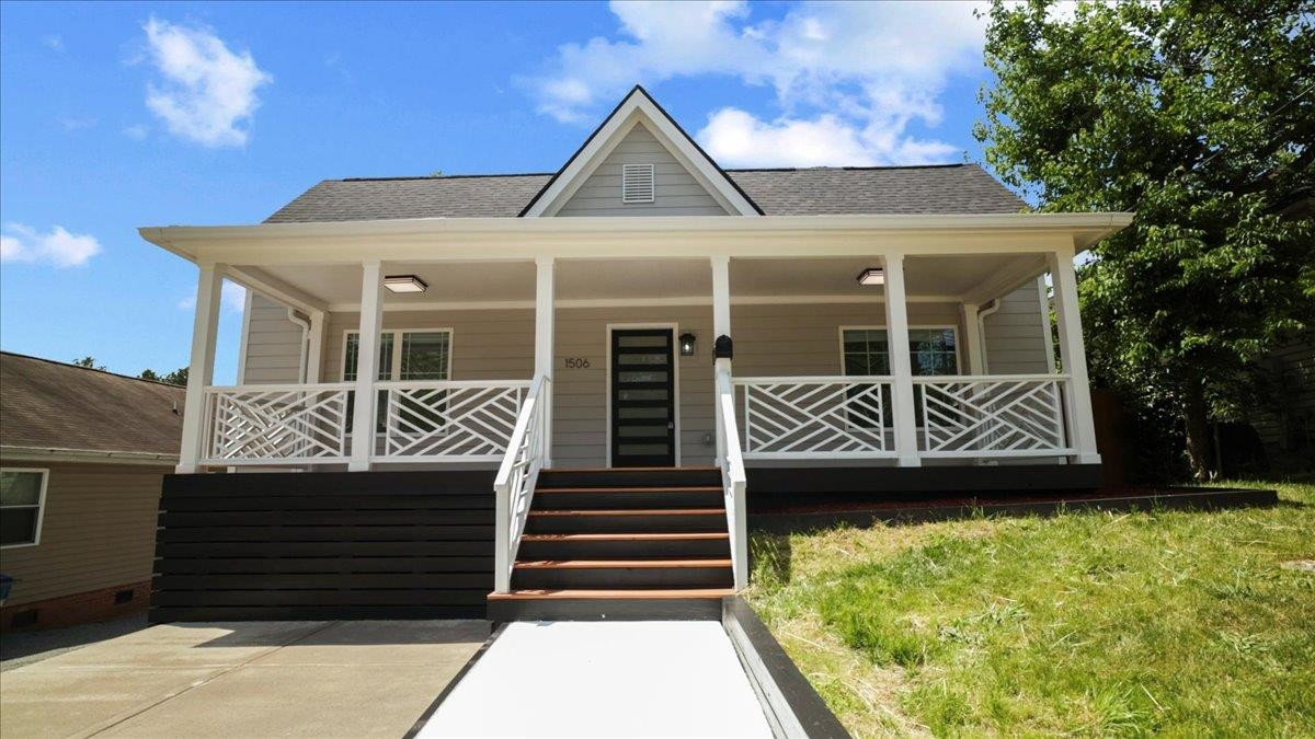 1506 Chapel Hill Road Durham, NC 27701 - Photo 2 of 50 a front view of a house with a yard