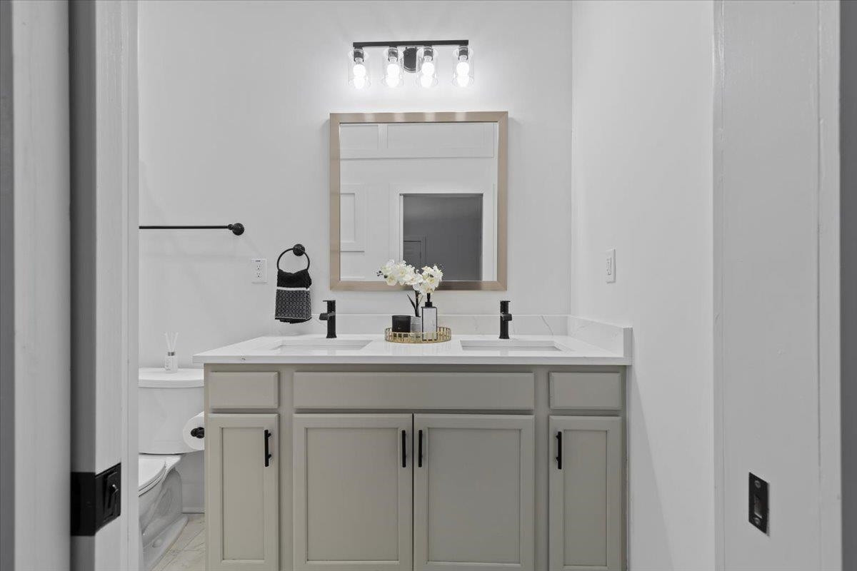 1506 Chapel Hill Road Durham, NC 27701 - Photo 29 of 50 a bathroom with a sink and a mirror