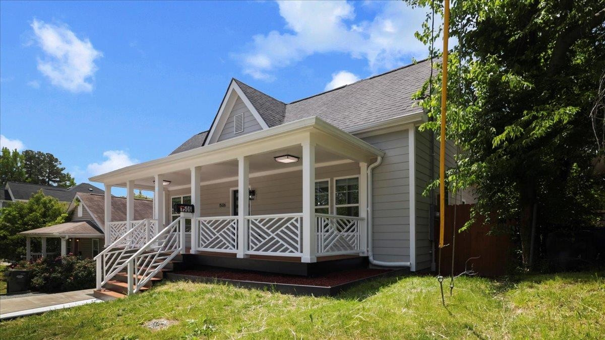 1506 Chapel Hill Road Durham, NC 27701 - Photo 3 of 50 a view of a house with a yard and wooden deck