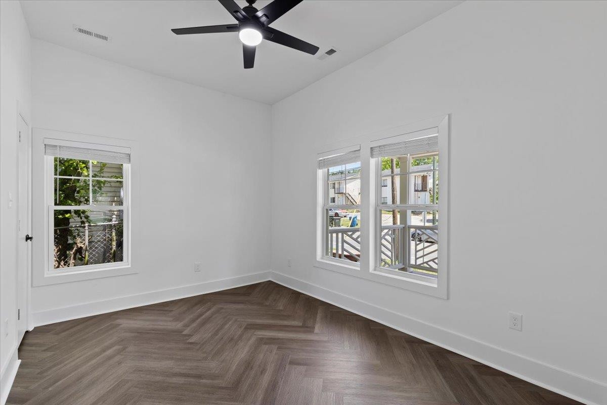 1506 Chapel Hill Road Durham, NC 27701 - Photo 31 of 50 a view of an empty room with a window and wooden floor