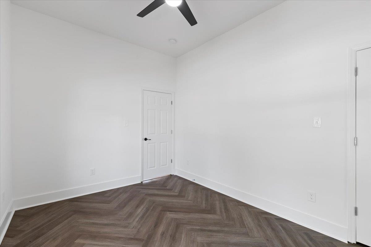 1506 Chapel Hill Road Durham, NC 27701 - Photo 34 of 50 a view of a room with wooden floor and ceiling fan