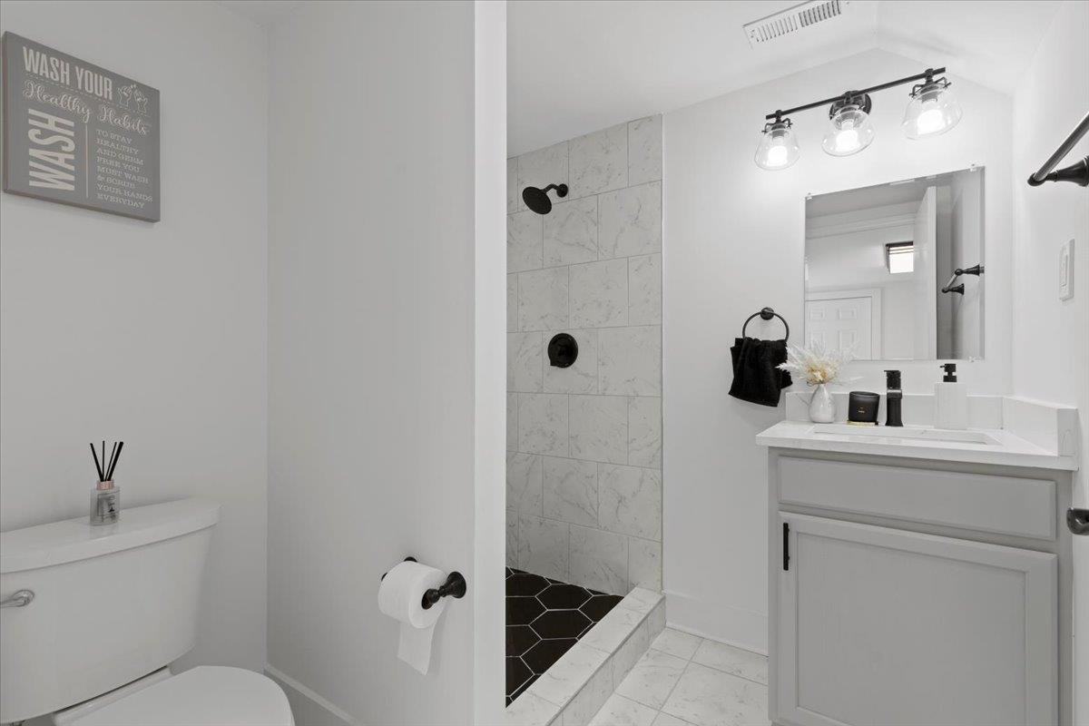 1506 Chapel Hill Road Durham, NC 27701 - Photo 45 of 50 a bathroom with a sink a toilet and shower