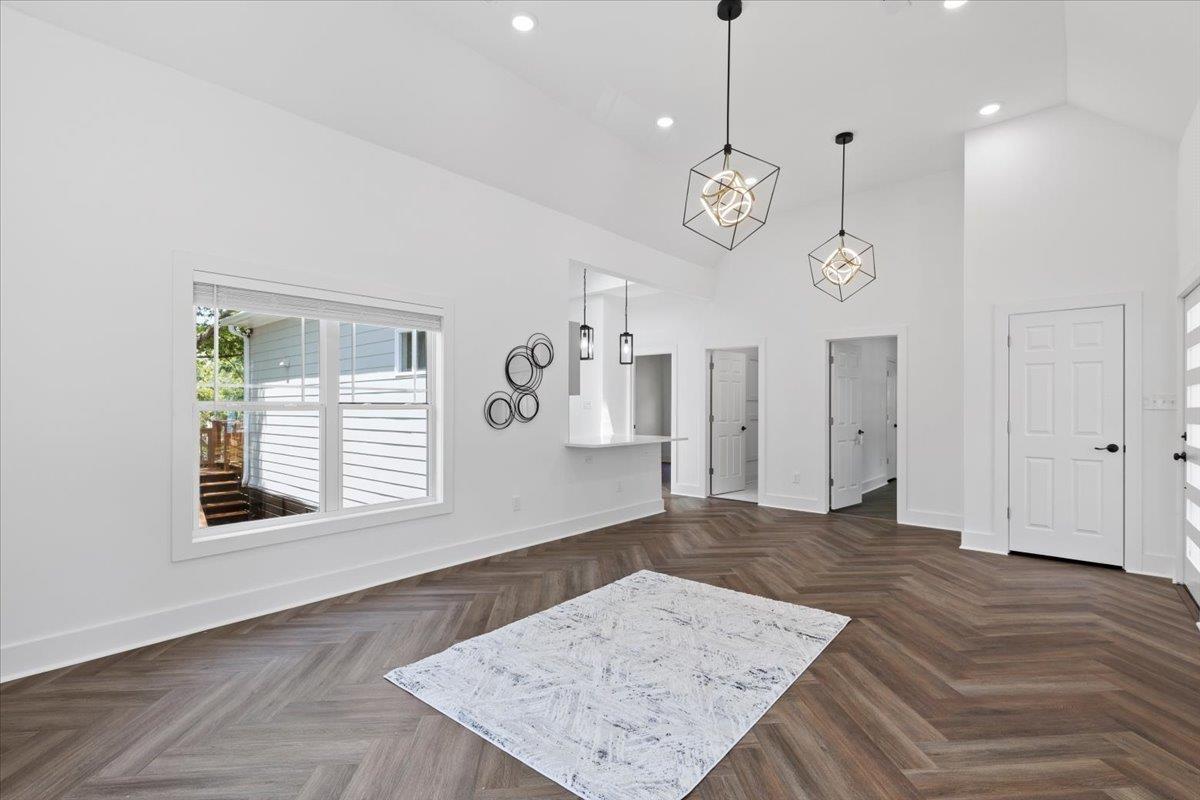 1506 Chapel Hill Road Durham, NC 27701 - Photo 10 of 50 a view of an empty room with wooden floor and a window