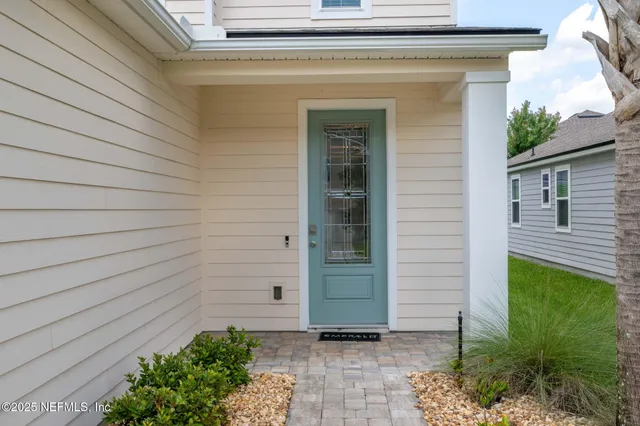 a view of entryway with wooden floor and window
