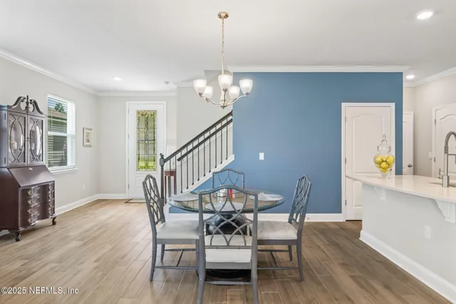a kitchen with stainless steel appliances a refrigerator sink and microwave