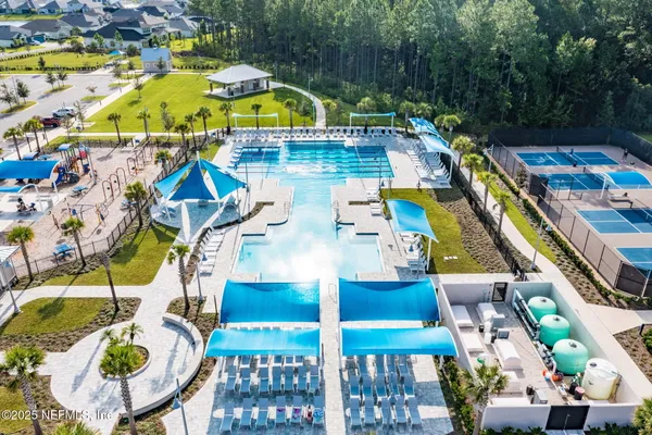 a front view of a house with a garden and plants