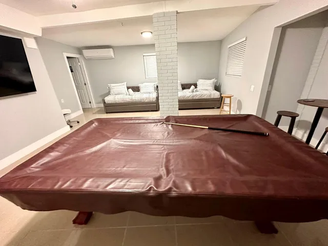 a bedroom with a bed and a mirror