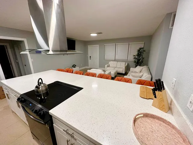 a kitchen with stainless steel appliances granite countertop sink and cabinets