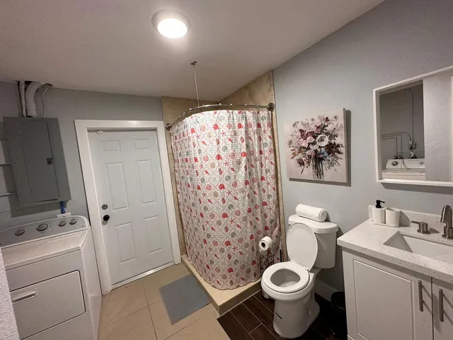 a bedroom with two beds and a window