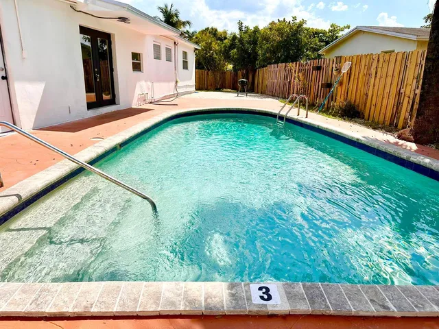 a view of swimming pool with a outdoor seating