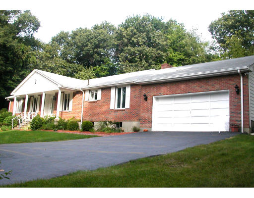 9 Cameron Road Andover, MA 01810 - Photo 1 of 15 a front view of a house with a garden and yard