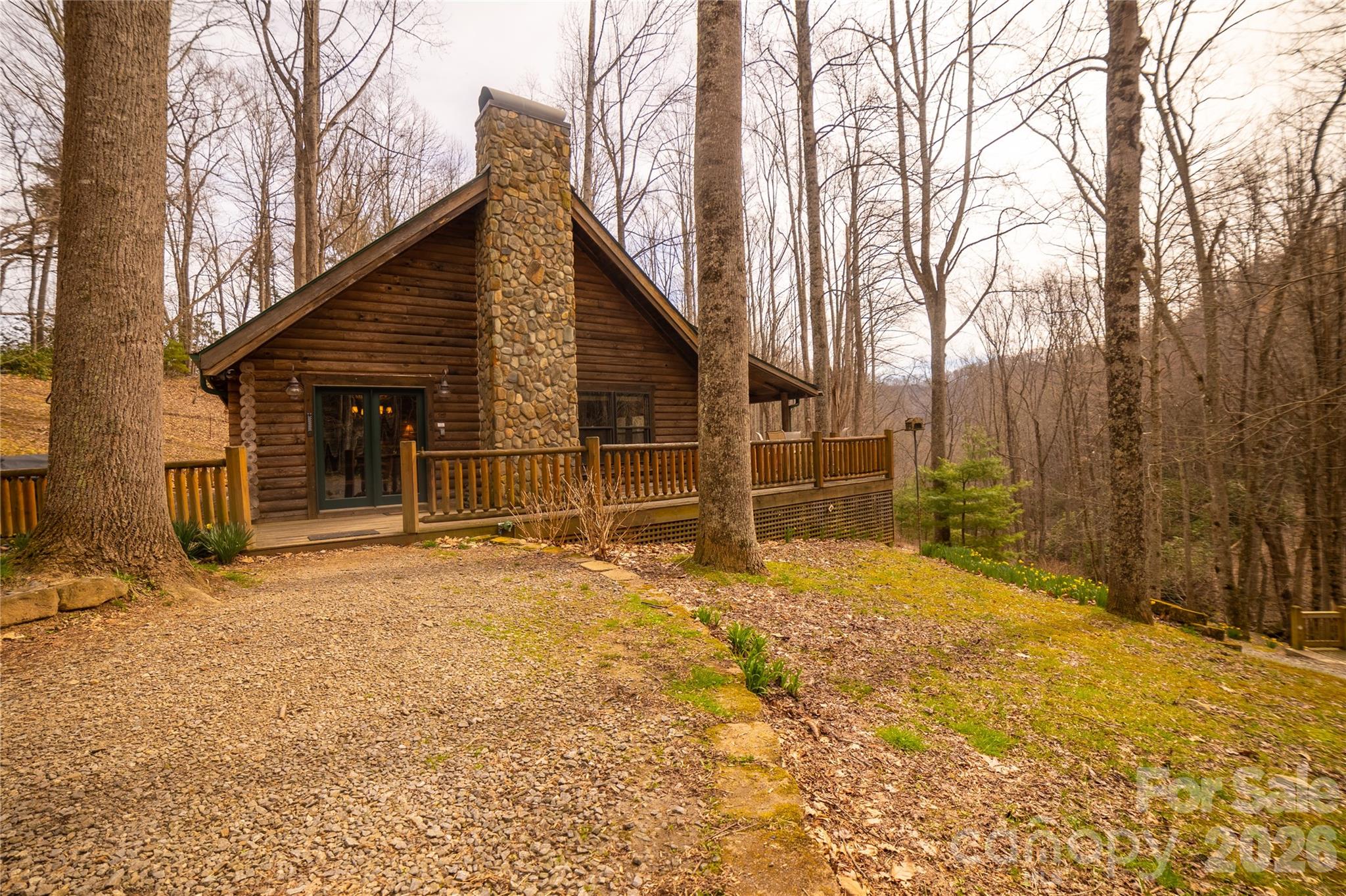682 Rock House Road Hot Springs, NC 28743 - Photo 4 of 43 a view of a house with backyard and trees
