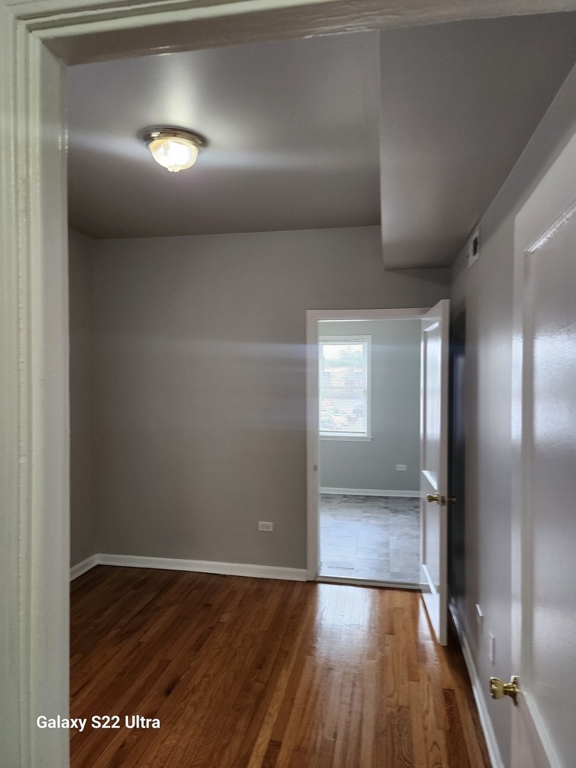 7823 South Evans Avenue, Unit 2 Chicago, IL 60619 - Photo 11 of 13 a view of wooden floor