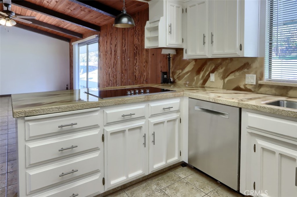 31729 Cherokee Road Coarsegold, CA 93614 - Photo 17 of 68 a kitchen with granite countertop cabinets appliances and a window