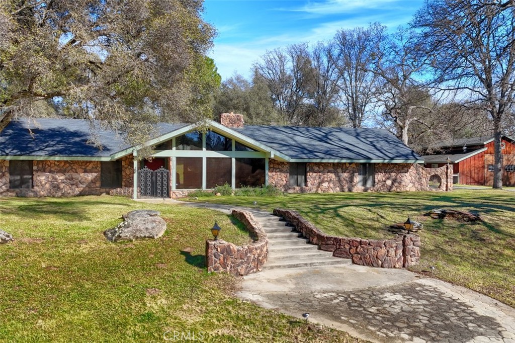 31729 Cherokee Road Coarsegold, CA 93614 - Photo 52 of 68 a front view of a house with garden