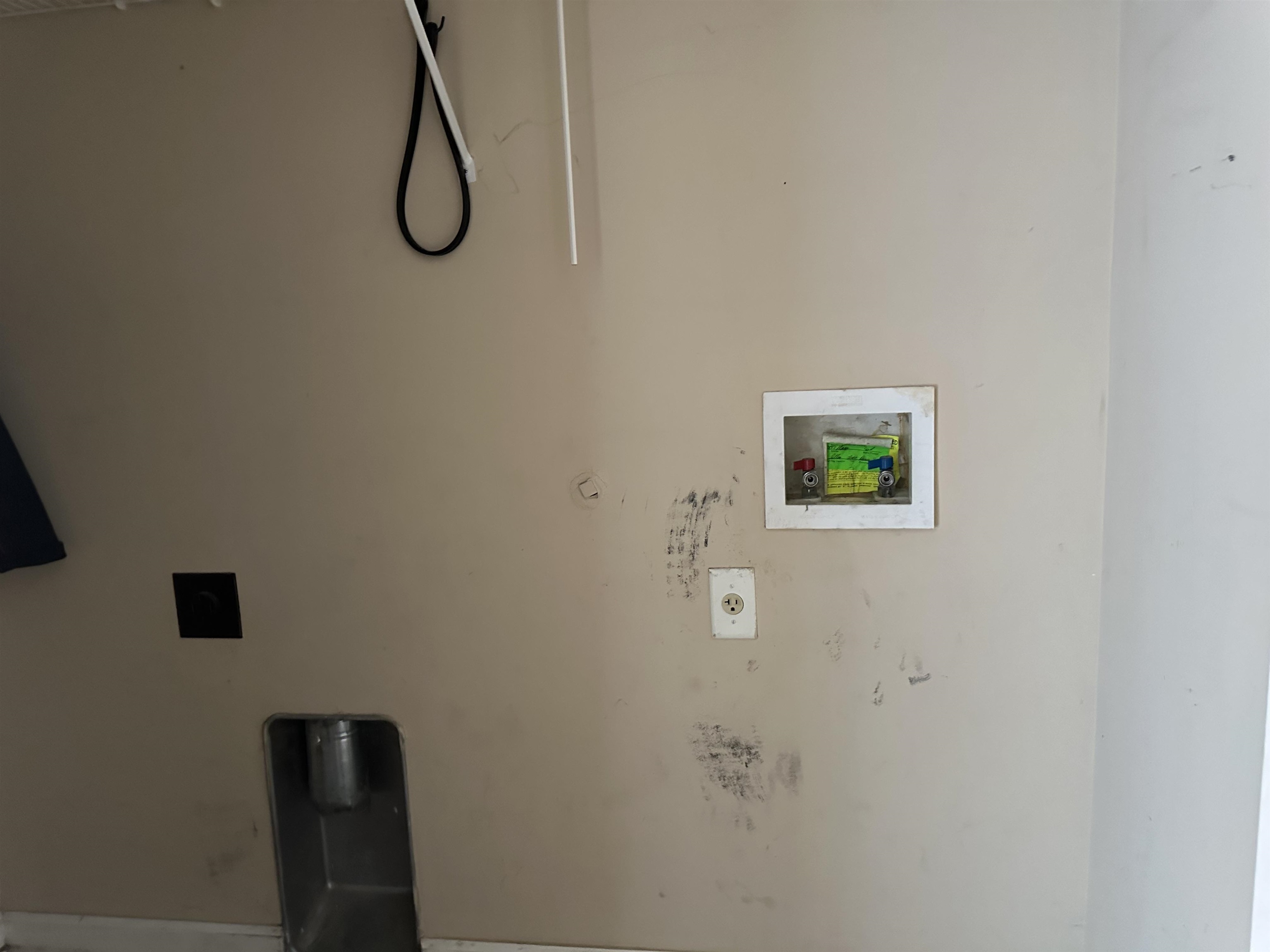8857 Macon Road Memphis, TN 38018 - Photo 11 of 13 Utility area featuring a wall-mounted washing machine hookup, a dryer vent opening, an electrical outlet, and a utility sink drain