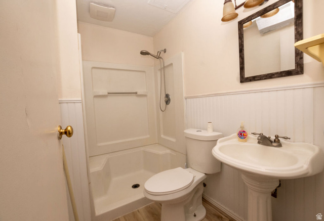 570 West Main Street Beaver, UT 84713 - Photo 24 of 43 Bathroom featuring a pedestal sink, toilet, and white fiberglass shower stall with a showerhead