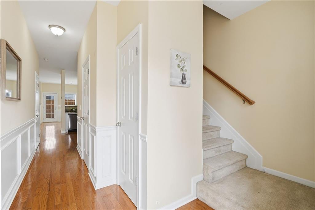 3801 Thayer Trace Duluth, GA 30096 - Photo 4 of 52 a view of a hallway with wooden floor and entryway