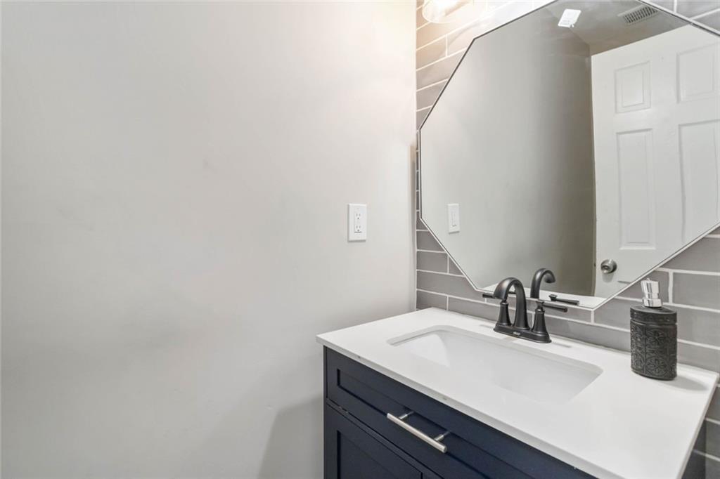 2119 Tudor Castle Way Decatur, GA 30035 - Photo 20 of 35 a bathroom with a sink and a mirror