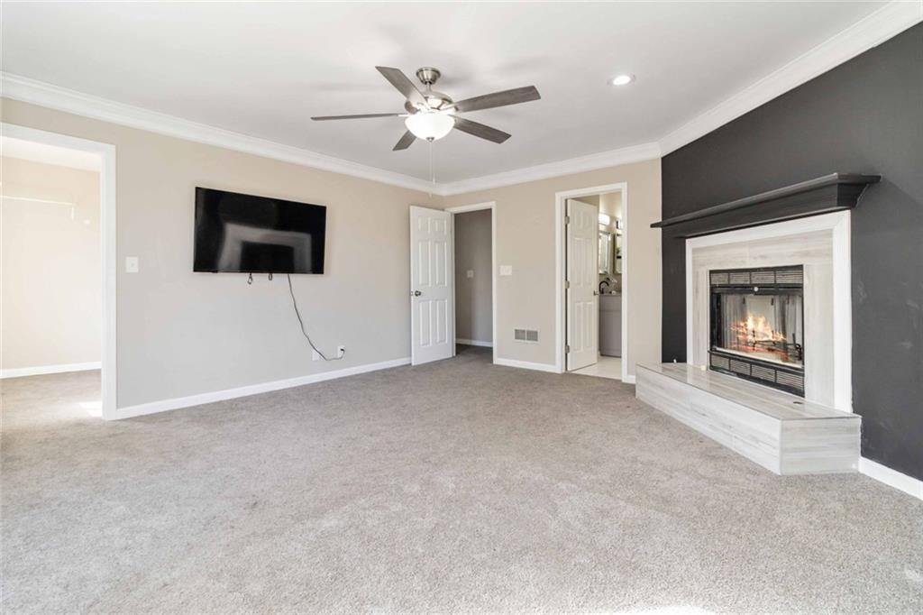 2119 Tudor Castle Way Decatur, GA 30035 - Photo 23 of 35 a view of a livingroom with a ceiling fan and a window
