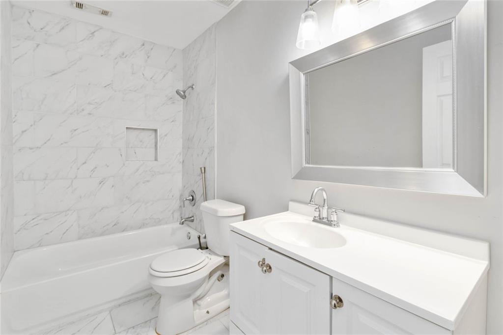 2119 Tudor Castle Way Decatur, GA 30035 - Photo 27 of 35 a bathroom with a sink a toilet and shower