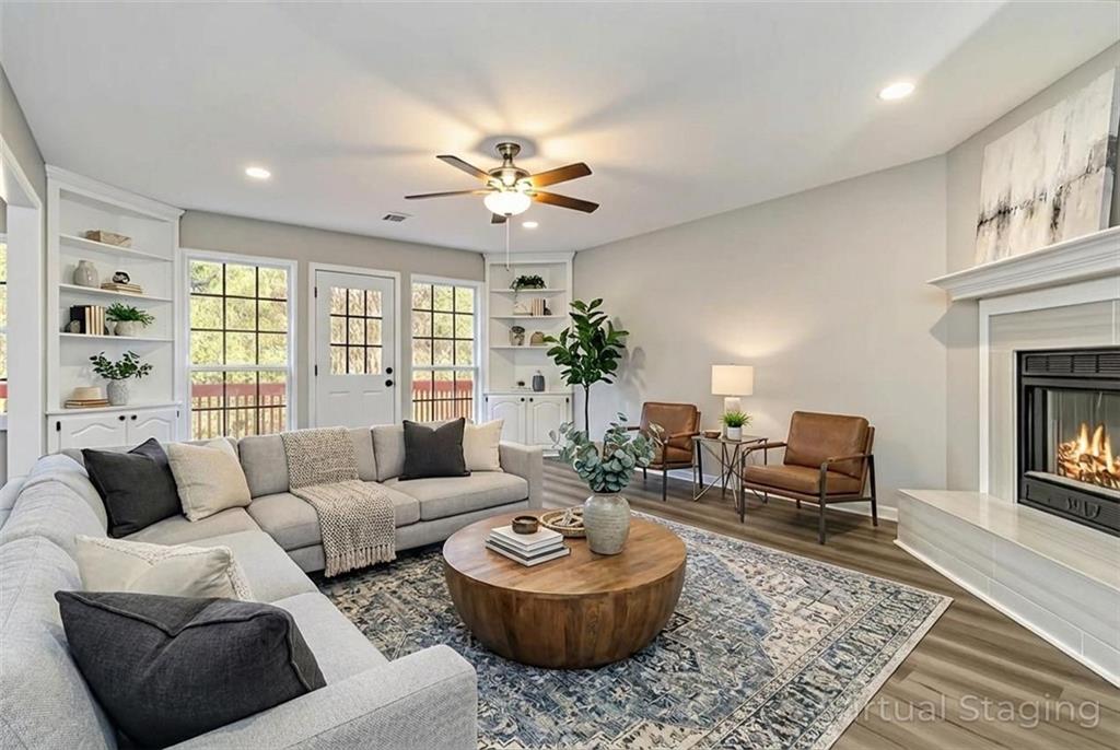 2119 Tudor Castle Way Decatur, GA 30035 - Photo 3 of 35 a living room with furniture and a fireplace