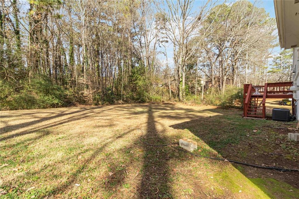2119 Tudor Castle Way Decatur, GA 30035 - Photo 32 of 35 a view of a yard with brick wall