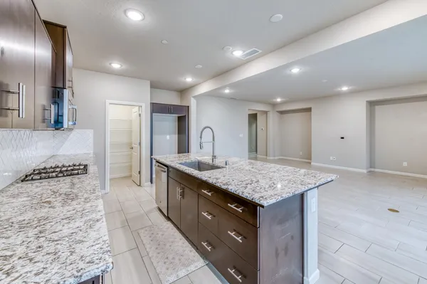 a kitchen with a stove and a sink