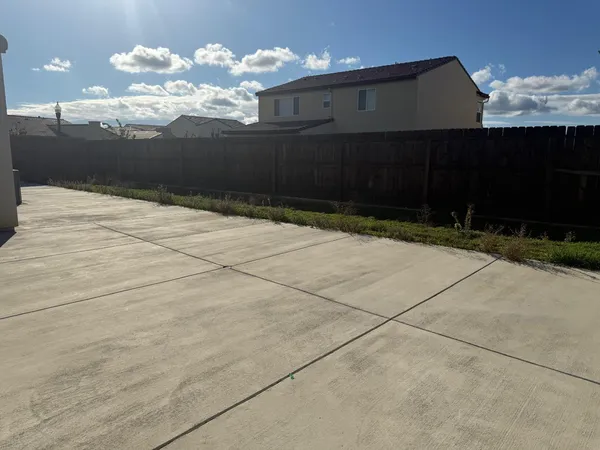 a vase of flowers sitting on a floor
