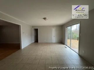 a kitchen with granite countertop a sink and a refrigerator