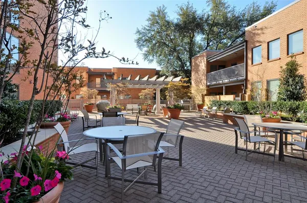 a view of a chairs and tables in the patio