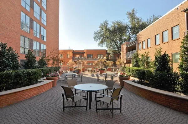 a view of a chairs and table in th balcony