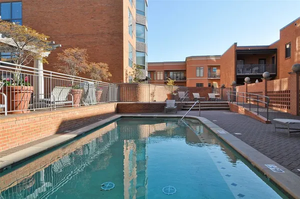 a view of a swimming pool with a patio