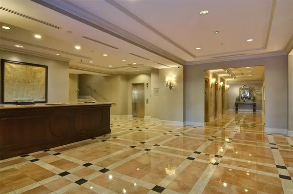 a view of a lobby with black carpet