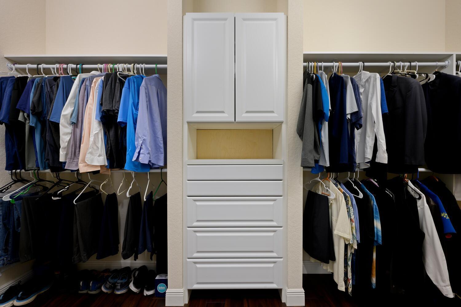 8024 Southwest Marin Drive Stuart, FL 34997 - Photo 11 of 26 a view of walk in closet with clothes and shoes