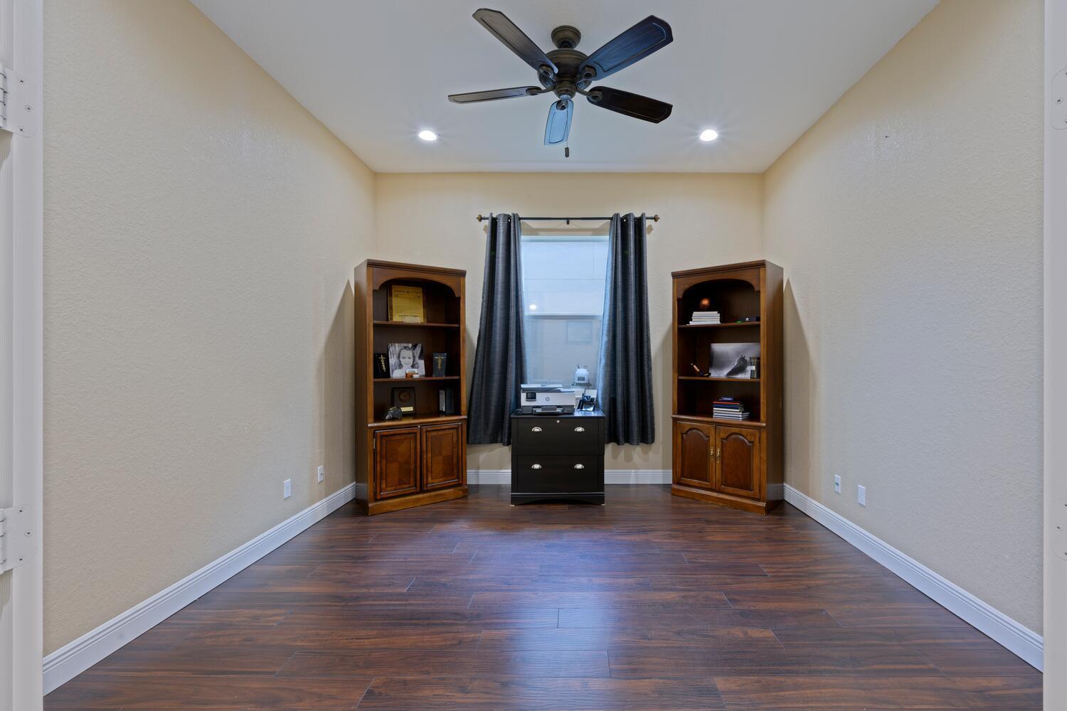 8024 Southwest Marin Drive Stuart, FL 34997 - Photo 18 of 26 a living room with furniture and wooden floor