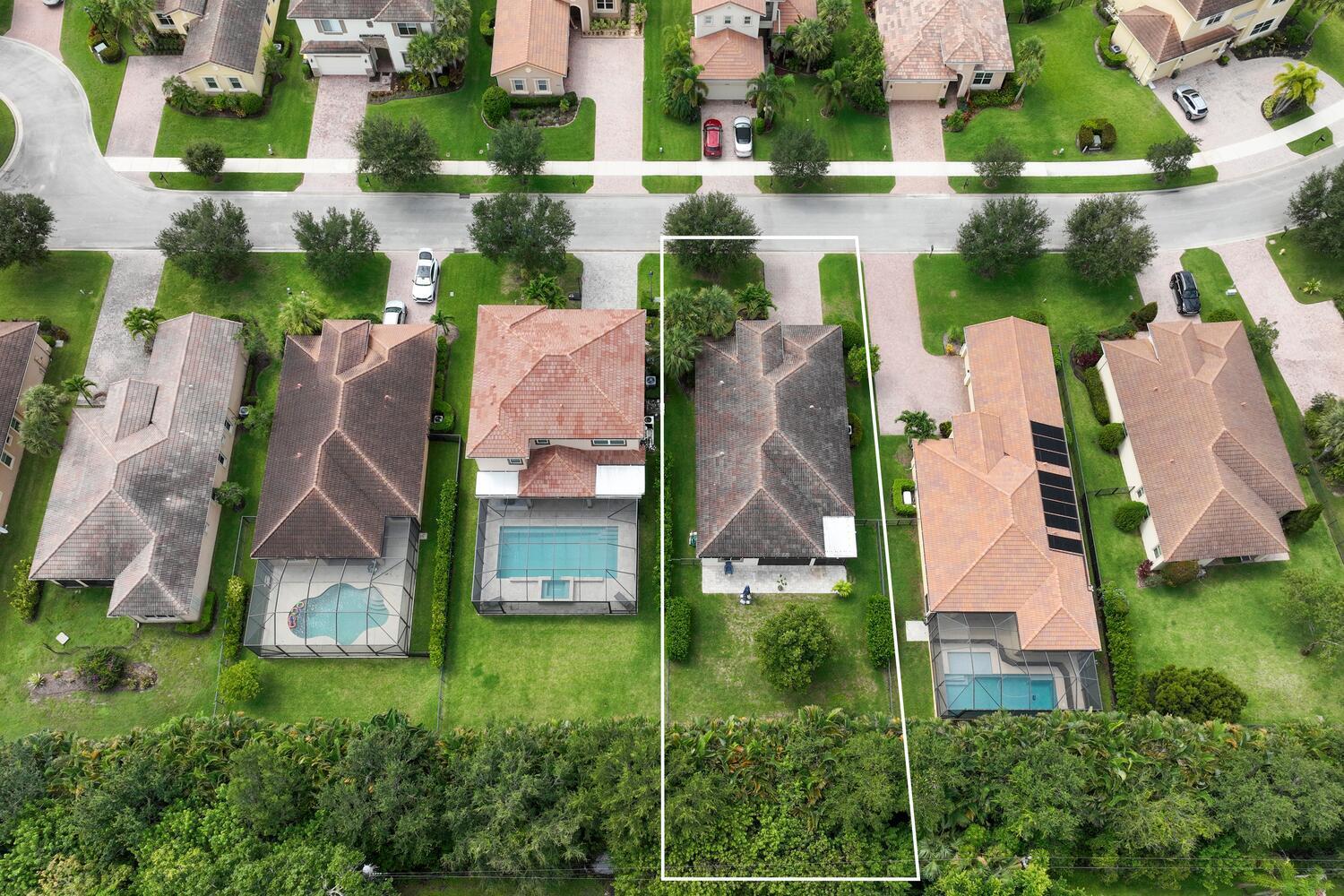 8024 Southwest Marin Drive Stuart, FL 34997 - Photo 23 of 26 an aerial view of a house with a yard and lake view