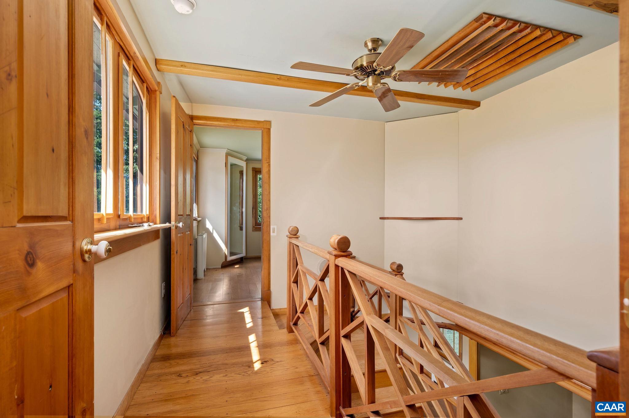 6265 Midway Road Charlottesville, VA 22903 - Photo 12 of 68 a view of a hallway with wooden floor and staircase