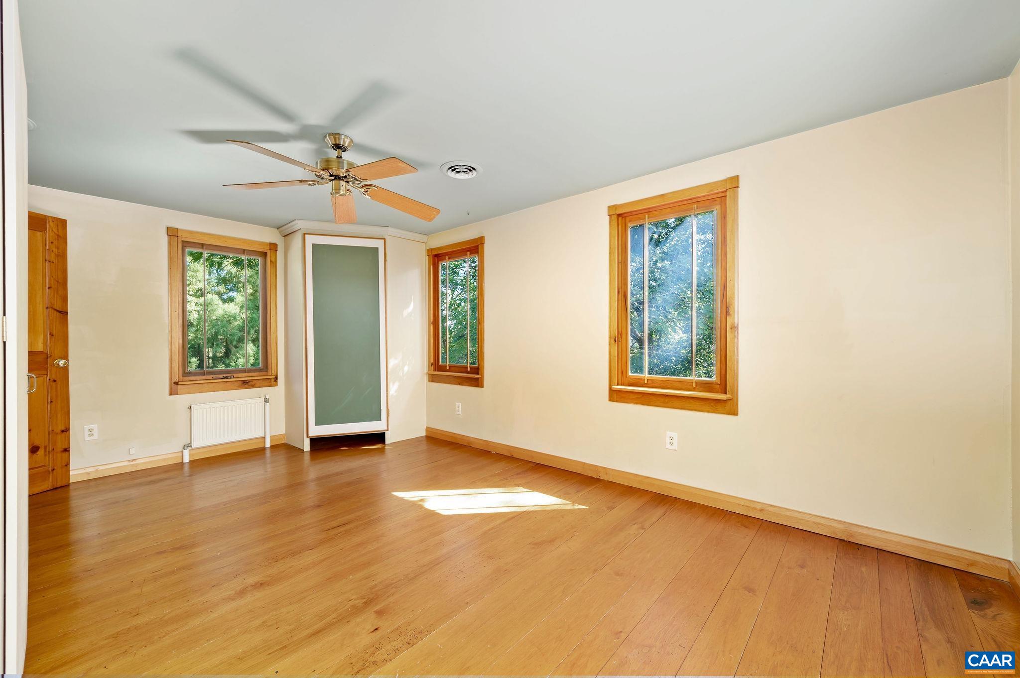 6265 Midway Road Charlottesville, VA 22903 - Photo 16 of 68 a view of an empty room with window and wooden floor