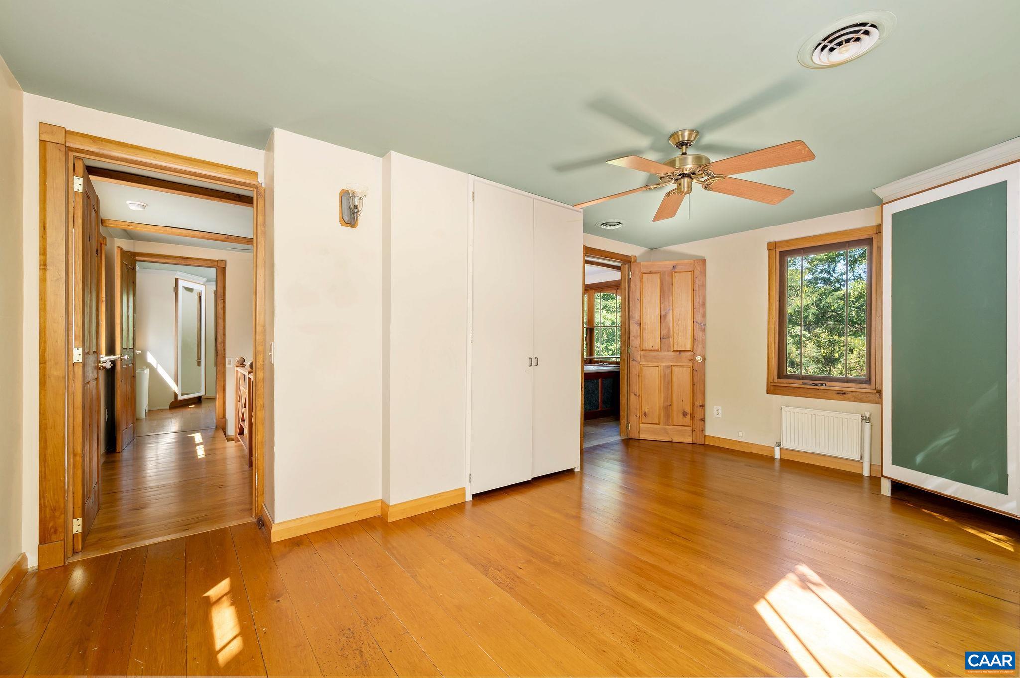 6265 Midway Road Charlottesville, VA 22903 - Photo 17 of 68 a view of an empty room with window and wooden floor