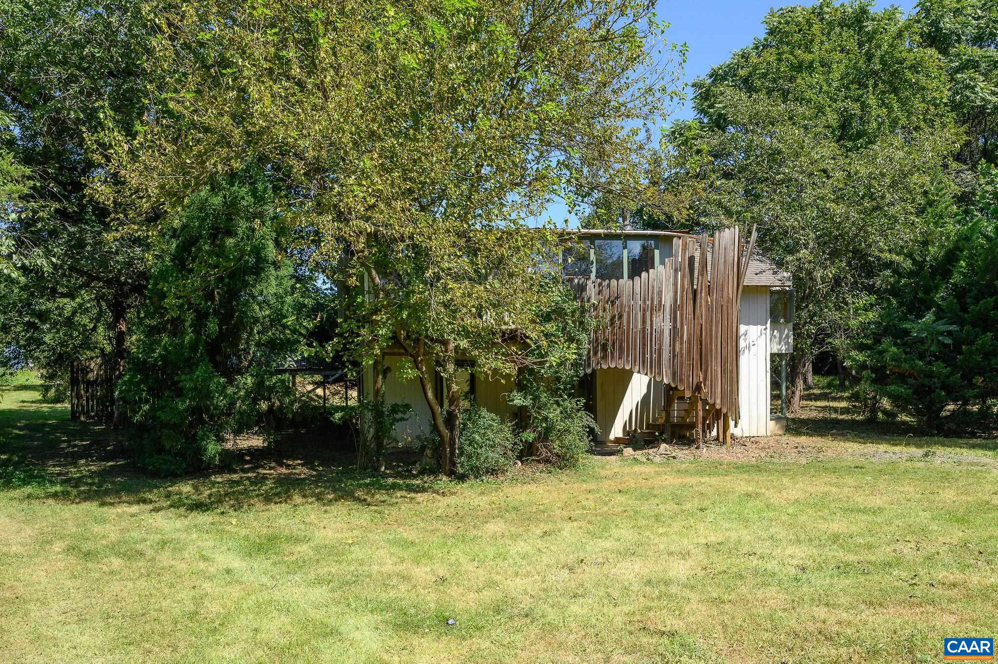 6265 Midway Road Charlottesville, VA 22903 - Photo 37 of 68 a view of a backyard with a slide and potted plants