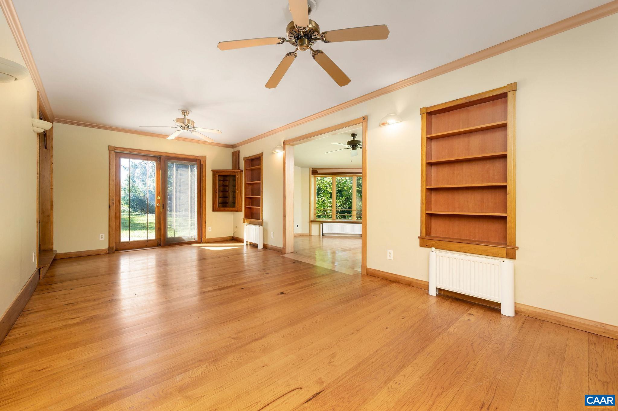 6265 Midway Road Charlottesville, VA 22903 - Photo 4 of 68 a view of an empty room with a window and wooden floor