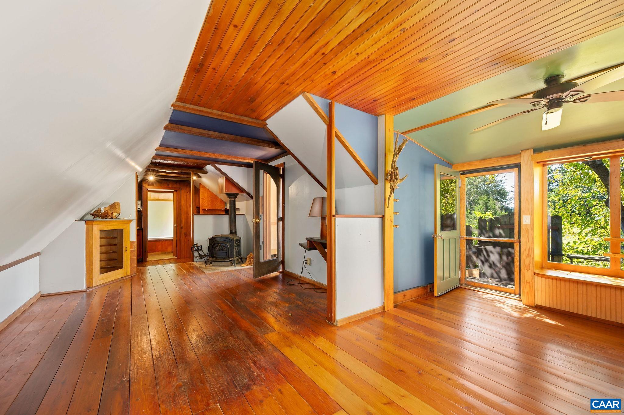 6265 Midway Road Charlottesville, VA 22903 - Photo 46 of 68 a view of a room with wooden floor and iron stairs