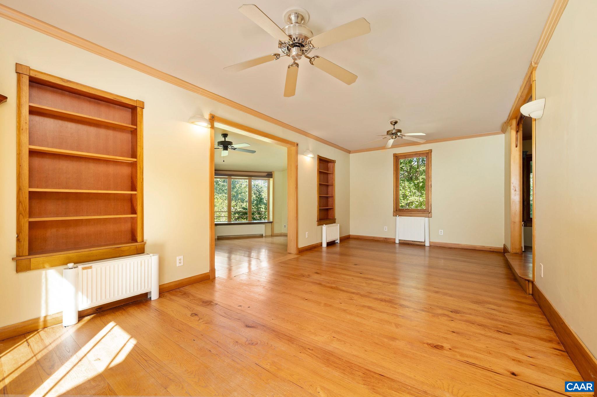 6265 Midway Road Charlottesville, VA 22903 - Photo 5 of 68 a view of an empty room with window and wooden floor