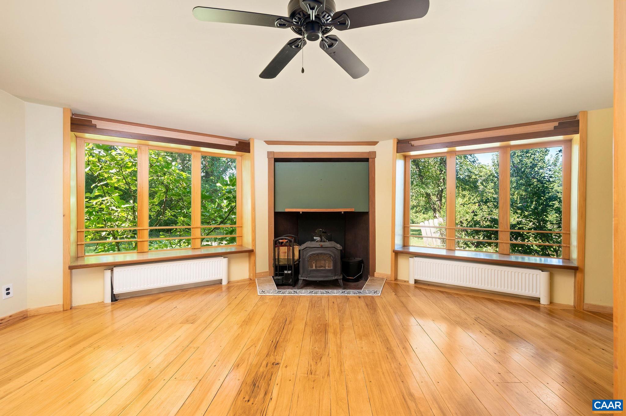 6265 Midway Road Charlottesville, VA 22903 - Photo 6 of 68 a view of an empty room with a fireplace and a window