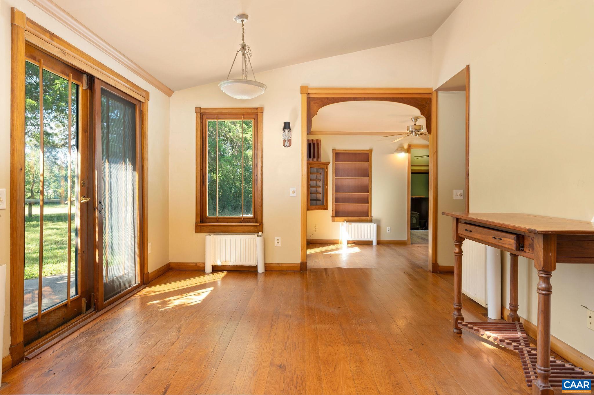 6265 Midway Road Charlottesville, VA 22903 - Photo 8 of 68 a view of empty room with wooden floor and fan