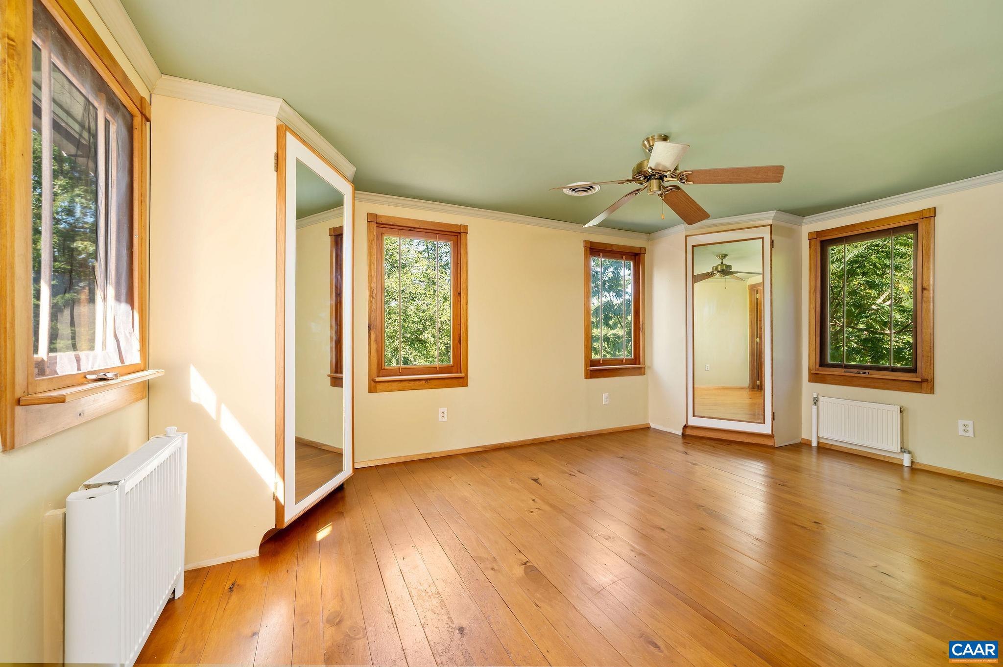 6265 Midway Road Charlottesville, VA 22903 - Photo 9 of 68 a view of an empty room with window and wooden floor