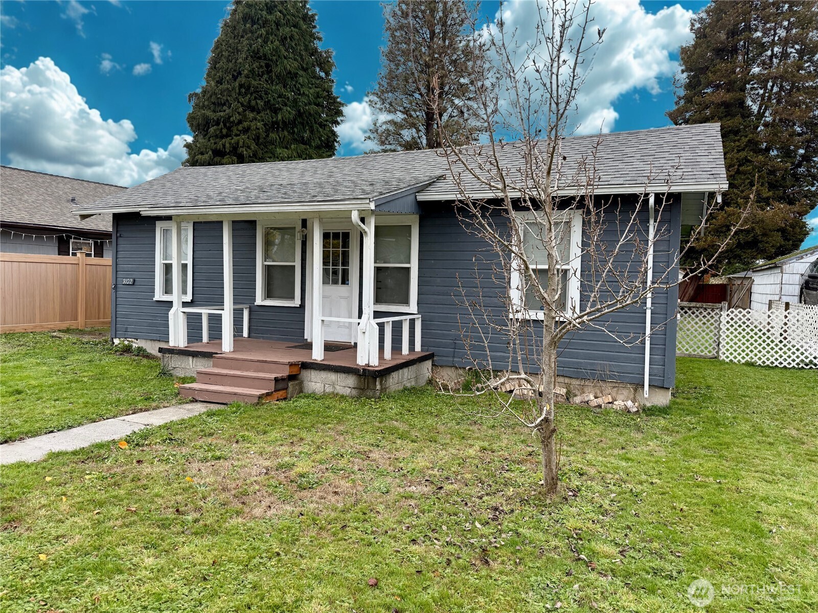 3102 Garfield Street Longview, WA 98632 - Photo 2 of 20 a view of a house with a yard and sitting area
