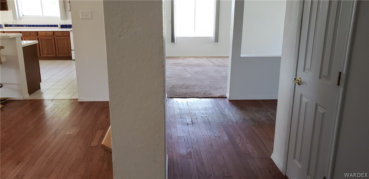 10002 East Blake Ranch Road, Unit 3 Kingman, AZ 86401 - Photo 14 of 42 a view of a hallway with wooden floor